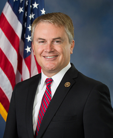 Official portrait of James Comer